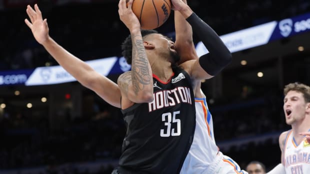 Nov 17, 2021; Oklahoma City, Oklahoma, USA; Houston Rockets center Christian Wood (35) is fouled by Oklahoma City Thunder forward Jeremiah Robinson-Earl (50) on the way to the basket during the second quarter at Paycom Center. Mandatory Credit: Alonzo Adams-USA TODAY Sports